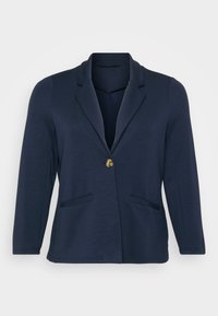 Blazer bleu marine avec un col cranté, fermeture à bouton doré unique et deux poches avant. Tissu doux et lisse avec une forme structurée.