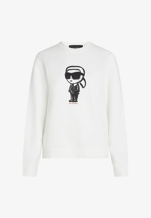 Witte sweatshirt met een zwart stripfiguur van een figuur met een zonnebril en een pak, met rode tekst "KARL LAGERFELD."