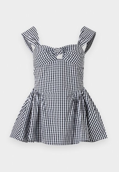 Μαύρο-άσπρο καρό αμάνικο φόρεμα με φαρδιές τιράντες, κόμπο στο μπροστινό μέρος, εφαρμοστή μέση και φουσκωτή φούστα.