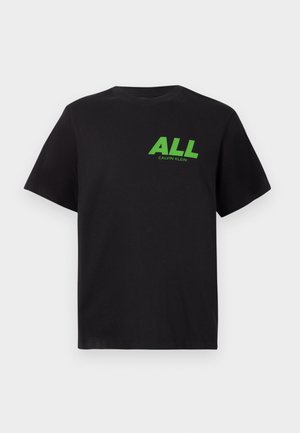 Black short-sleeve T-shirt with green "ALL" text and smaller "Calvin Klein" logo printed on the upper left chest.