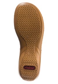 Brown rubber shoe sole featuring a textured wavy pattern, with a visible size "37" and a red brand logo "rieker" embedded at the back.