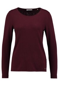 Pull en maille bordeaux à manches longues et col rond, avec une petite étiquette de marque en métal près de l'ourlet, taille petite.