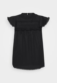 Vestido negro de manga corta con escote redondo, detalles de encaje y ganchillo en el pecho, con volantes y borde de pompones pequeños en las mangas y el dobladillo.