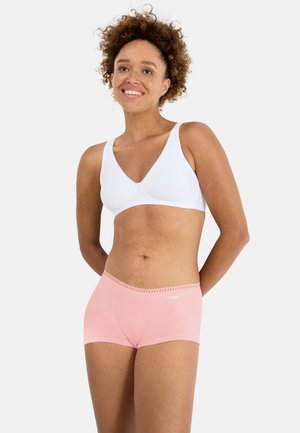 White cotton bralette with a V-neck design and pale pink short underwear featuring decorative trim at the waistband.