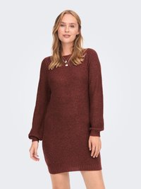 Abito maglione in bordeaux con maniche lunghe a palloncino, polsini e orlo a coste. Tessuto morbido, lunghezza a metà coscia, vestibilità rilassata.