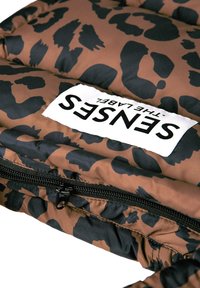 Brown puffer material with a black leopard print pattern. Features a black zipper and a white label with "SENSES" text prominently displayed.