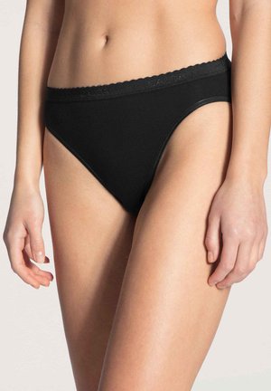 Black cotton panties with a ribbed texture. Features a scalloped waistband and a high-cut leg design, offering a snug fit.