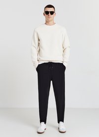 Calliope GINNICI CON POLSINI - Jogginghose - nero