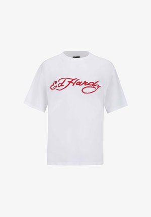 Valkoinen lyhythihainen t-paita, jossa on pyöreä kaula-aukko ja punaisella brodeerattu "Ed Hardy" -teksti rinnassa. Sileä kangas.