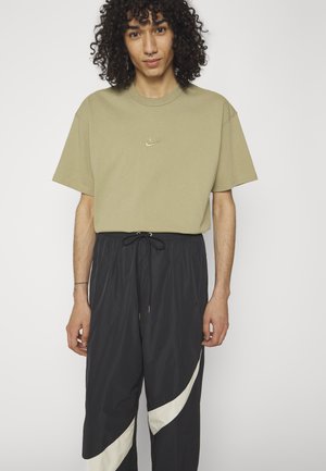 Nike Sportswear PANT - Pantalones deportivos - black/coconut milk