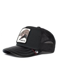 Black baseball cap with mesh sides, featuring a front patch of a monster's head. Stitch detailing on the brim, and a logo on the side.
