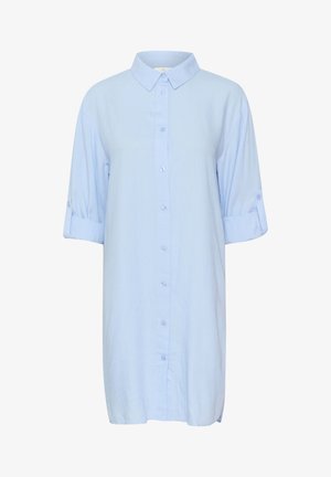 Heledad sinine, lühikeste varrukatega nööbiga särk, mis on valmistatud kerge kangaga. Omab klassikalist kraed ja üleskeeratud varrukaid koos nööbiga detailiga.