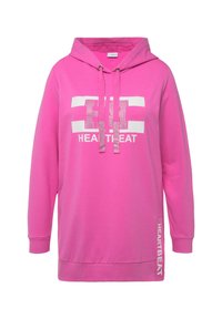Sudadera rosa con capucha, con un gráfico blanco que dice "HEARTBEAT" y acentos de strass. Hecha de material suave y liso con mangas largas.