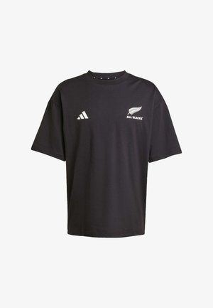 Black short-sleeve t-shirt made of cotton. Features white "All Blacks" logo and Adidas stripes on the left chest. Relaxed fit and crew neck.