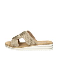 Beige woven slip-on sandal with crisscross straps, soft footbed, and white-striped rubber sole. Textured fabric and smooth insole detail.
