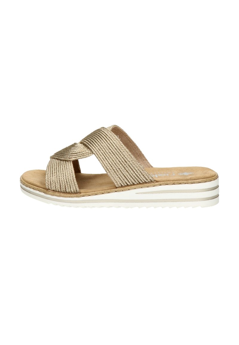 Beige woven slip-on sandal with crisscross straps, soft footbed, and white-striped rubber sole. Textured fabric and smooth insole detail.