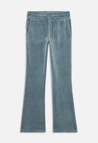 Rozšířené tepláky z jemné tyrkysové látky s elastickým pasem, stahovací šňůrkou a dvěma bočními kapsami. Hladká textura a uvolněný střih.