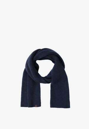 Tamsiai mėlynas megztas šalikas su riboto rašto tekstūra, pasižymintis plačiu, ilgu dizainu ir maža odine logotipo etikete viename gale.