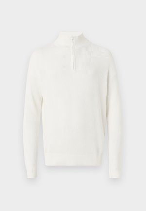 Cream-colored, ribbed sweater with a high collar and half-zip closure. Long sleeves and a relaxed fit. Soft texture and minimal design.