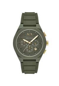 Orologio verde in silicone con finitura opaca, dettagli dorati, sottodial cronografici e finestra per la data. Presenta un cinturino in gomma testurizzata.
