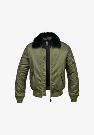 Bomberjack in olijfgroen met een kraag van nepbont, ritssluiting aan de voorkant en geribde manchetten. Voorzien van een ritstasje op de linkermouw.