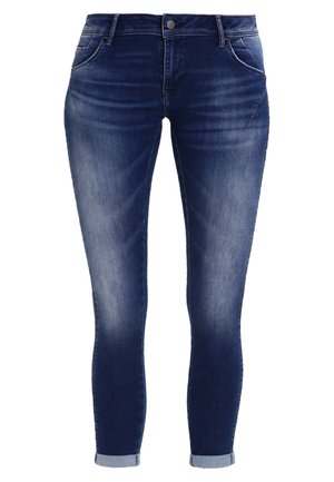 Skinny jeans in dark blue denim with light fading, five-pocket design, and cuffs rolled at the hem. Button and zipper closure.