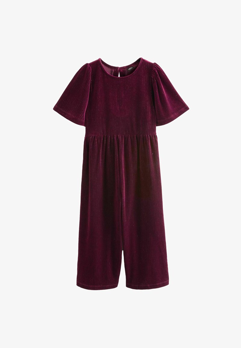 Burgundijas samta kombinezons ar īsām pūkām, apaļu kakla izgriezumu un elastīgu jostas vietu. Garums līdz pusmēles augumam, ar gludu tekstūru un vieglu spīdumu.