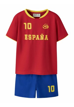 Maillot de football rouge à manches courtes avec bordure jaune, "10" et "ESPAÑA" en jaune, associé à un short bleu avec un "10" jaune sur la jambe.