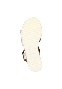 Strappy sandal sole in white rubber with horizontal grooves, featuring a tan accent strap and a flat design for stability.