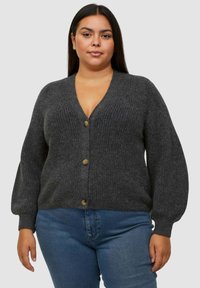 Cardigan grigio lavorato a maglia con scollo a V, apertura frontale e grandi bottoni. Presenta maniche a palloncino e tessuto testurizzato.