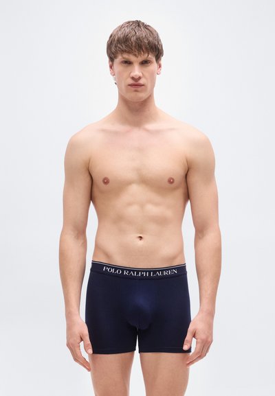 Ανδρικά ναυτικά μπλε μποξέρ με εφαρμοστή σχεδίαση. Η ελαστική μέση διαθέτει το λογότυπο "POLO RALPH LAUREN". Μαλακό, ελαστικό ύφασμα.