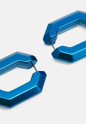 Blue aluminum carabiner with an angular design, glossy finish, and metallic texture. Features a secure metal closure for practicality.