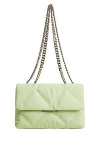 Light green quilted handbag with a flap closure, silver chain strap, and diagonal stitching pattern. Soft fabric texture.