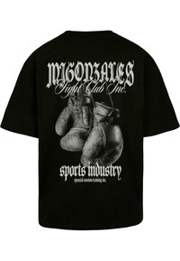 Melnā T-kreklu ar grafiku, kurā redzami piekārti boksa cimdi, un baltu tekstu "MIGONZALES Fight Club Inc." un "sporta industrija."