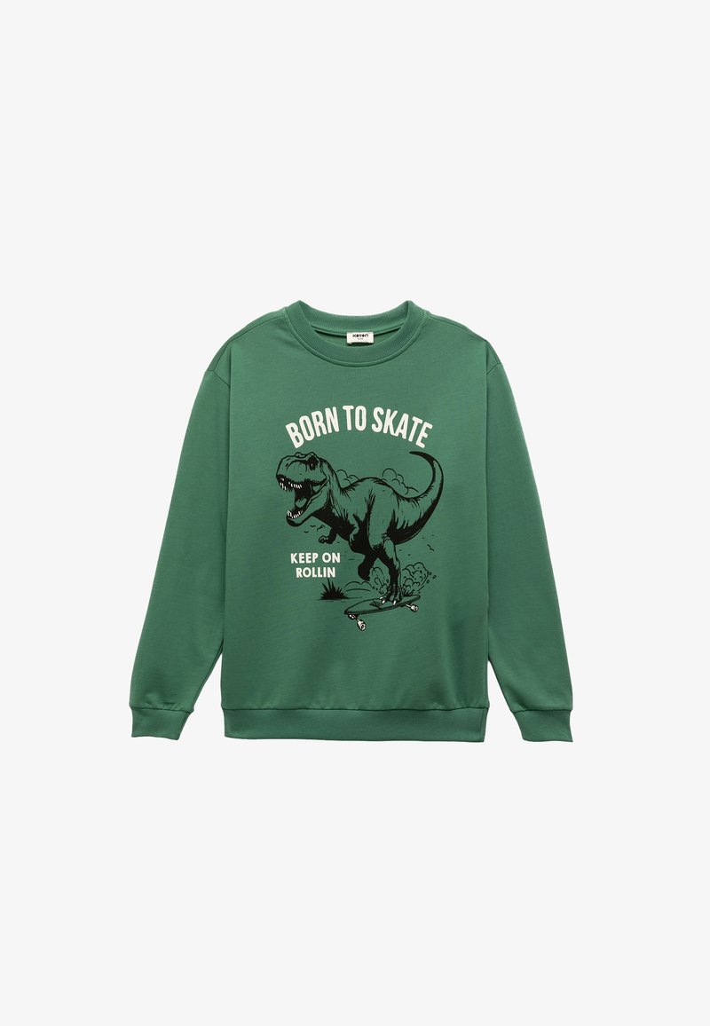 Groene sweat, gemaakt van katoen, met een dinosaurustekening en de teksten "Born to Skate" en "Keep on Rollin" in zwart-wit.