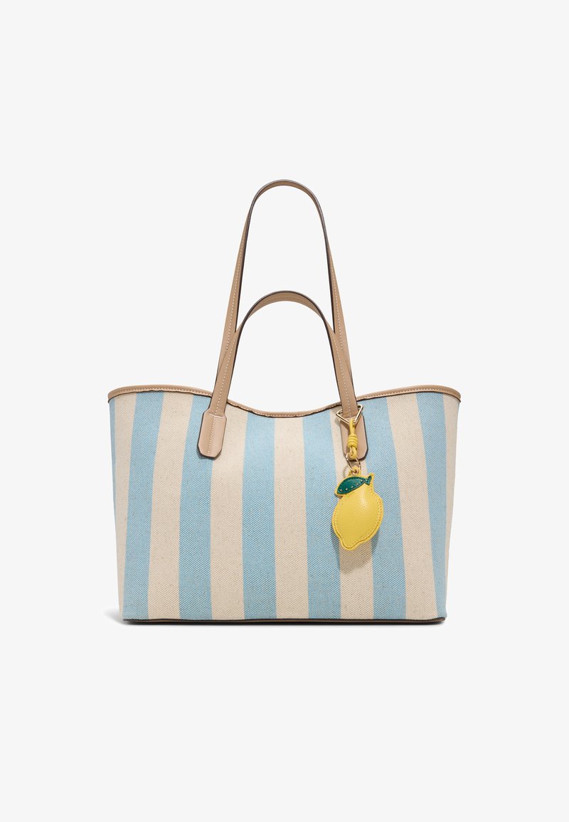 Canvas tote bag with vertical blue and beige stripes, tan leather handles, and a yellow lemon-shaped charm attached.