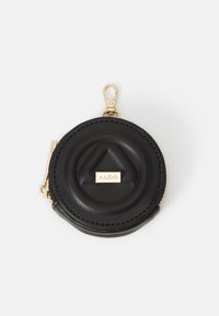 Porte-monnaie rond en cuir noir avec fermeture éclair dorée, clip et plaque logo ALDO à l'avant.
