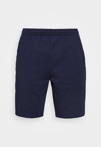 Tummansinisiä puuvillahousuja, joissa on joustava vyötärö, sivutaskut ja suora leikkaus. Pehmeä pinta ja yksinkertainen muotoilu.