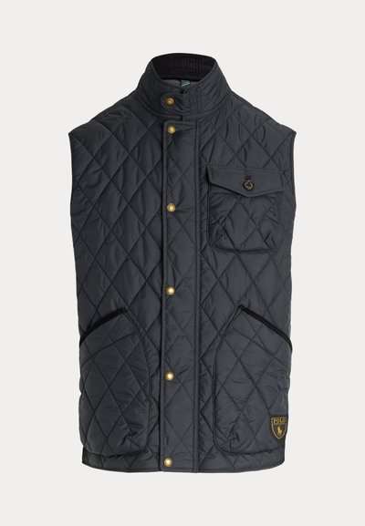 Mustast tikandiga varrukateta vest kuldsete nööpidega, rinnatasku klapiga, kaks alumist taskut ja Polo brändi logo patch alumisel osal.