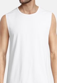 White sleeveless cotton tank top with a crew neckline, featuring a smooth texture and a simple design without patterns or accents.