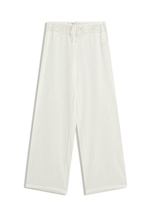 Witte linnen wijde broek met een elastische tailleband versierd met kant en een trekkoord. Zachte textuur en losse pasvorm voor optimaal comfort.