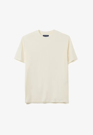 T-shirt in cotone crema con colletto rotondo e maniche corte. Design semplice, tessuto morbido e taglio dritto. Etichetta visibile sul colletto.