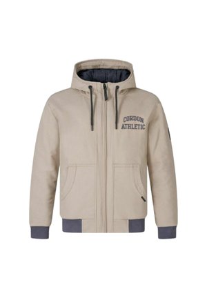 Beige Kapuzenjacke mit Reißverschluss, zwei seitlichen Taschen und gerippten Bündchen. Auf der linken Brust ist "CORDON ATHLETIC" in Marineblau aufgedruckt.