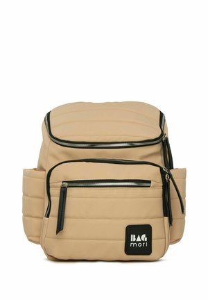 Beige quilted backpack made of synthetic material features multiple zippered compartments and black accents with a logo patch.