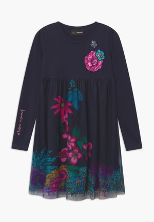 Robe bleu marine à manches longues avec des motifs floraux sur la jupe, la poitrine et la manche, brodée du texte « Crois en toi » en rose.