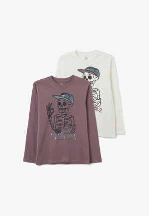 Two long-sleeve t-shirts: one in mauve with a graphic skeleton and cap, the other in white with a similar design featuring a different print.