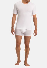 White short-sleeve fitted t-shirt with a round neckline and matching white snug boxer briefs, made from a smooth, stretchy fabric.
