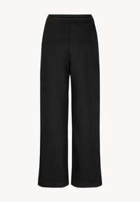 Zwarte wijduitlopende broek van zacht materiaal, met een elastische tailleband en een ontspannen pasvorm, zonder zichtbare naden of zakken.
