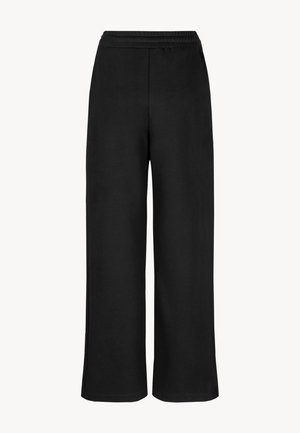 Czarne spodnie szerokie wykonane z miękkiego materiału, z elastycznym pasem i luźnym krojem, bez widocznych szwów i kieszeni.