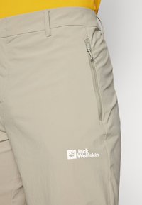 Jack Wolfskin HIKEOUT - Lauko kelnės - stone